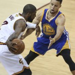 Cleveland Cavaliers guard Kyrie Irving (2) drives on Golden State Warriors guard Stephen Curry (30) during the first half of Game 6 of basketball's NBA Finals in Cleveland, Thursday, June 16, 2016. (AP Photo/Ron Schwane)
