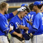 UC Santa Barbara's JJ Muno, center, is comforted by teammates Josh Adams, left, and Tevin Mitchell following the team's 3-0 loss to Arizona during an NCAA College World Series baseball game, Wednesday, June 22, 2016, in Omaha, Neb. (AP Photo/Nati Harnik)