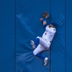 
              RETRANSMISSION TO CLARIFY THAT THE BATTER WAS OUT - Toronto Blue Jays center fielder Kevin Pillar makes a diving catch against the wall on a line drive by Arizona Diamondbacks left fielder Peter O'Brien during the fourth inning of a baseball game, Tuesday, June 21, 2016, in Toronto. (Nathan Denette/The Canadian Press via AP) MANDATORY CREDIT
            