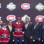 Mikhail Sergachev, fourth from right, ninth overall pick, stands with members of the Montreal Canadiens management team and others at the NHL draft in Buffalo, N.Y., Friday June 24, 2016. (Nathan Denette/The Canadian Press via AP) MANDATORY CREDIT