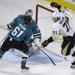 Pittsburgh Penguins' Evgeni Malkin, right, celebrates after scoring a goal against San Jose Sharks goalie Martin Jones and Justin Braun (61) during the second period of Game 4 of the NHL hockey Stanley Cup Finals, Monday, June 6, 2016, in San Jose, Calif. (AP Photo/Eric Risberg)