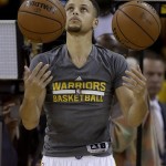 Golden State Warriors guard Stephen Curry warms up before Game 2 of basketball's NBA Finals between the Warriors and the Cleveland Cavaliers in Oakland, Calif., Sunday, June 5, 2016. (AP Photo/Ben Margot)