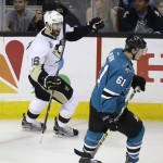 Pittsburgh Penguins right wing Eric Fehr, left, celebrates after scoring a goal as San Jose Sharks defenseman Justin Braun (61) looks on during the third period of Game 4 of the NHL hockey Stanley Cup Finals in San Jose, Calif., Monday, June 6, 2016. Pittsburgh won the game 3-1. (AP Photo/Eric Risberg)