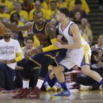 Cleveland Cavaliers forward LeBron James (23) dribbles against Golden State Warriors guard Klay Thompson during the first half of Game 1 of basketball's NBA Finals in Oakland, Calif., Thursday, June 2, 2016. (AP Photo/Marcio Jose Sanchez)