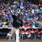 Coastal Carolina's G.K. Young celebrates his two-run home run against Arizona pitcher Bobby Dalbec in the  sixth inning in Game 3 of the NCAA College World Series baseball finals in Omaha, Neb., Thursday, June 30, 2016. (AP Photo/Ted Kirk)