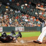 Arizona Diamondbacks' Brandon Drury, left, slides and scores past Houston Astros starting pitcher Mike Fiers, right, after Fiers threw a wild pitch during the third inning of a baseball game Wednesday, June 1, 2016, in Houston. (AP Photo/Eric Christian Smith)