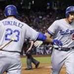 Los Angeles Dodgers' Corey Seager (5) slaps hands with Adrian Gonzalez (23) after Seager's home run against the Arizona Diamondbacks during the fifth inning of a baseball game Monday, June 13, 2016, in Phoenix. (AP Photo/Ross D. Franklin)
