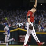 Arizona Diamondbacks' Patrick Corbin, right, raises his arm in frustration after giving up a three-run home run to Los Angeles Dodgers' Scott Van Slyke, left, during the sixth inning of a baseball game Wednesday, June 15, 2016, in Phoenix. (AP Photo/Ross D. Franklin)