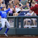 UC Santa Barbara right fielder Michael McAdoo catches a foul ball by Arizona's Zach Gibbons during the fifth inning of an NCAA College World Series baseball game, Wednesday, June 22, 2016, in Omaha, Neb. (AP Photo/Nati Harnik)