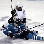 Pittsburgh Penguins' Matt Cullen, top, collides with San Jose Sharks' Logan Couture, bottom, during the first period of Game 4 of the NHL hockey Stanley Cup Finals on Monday, June 6, 2016, in San Jose, Calif. (AP Photo/Eric Risberg)
