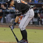 Miami Marlins' Ichiro Suzuki, of Japan, places his bat down after earning a walk against the Arizona Diamondbacks during the ninth inning of a baseball game Sunday, June 12, 2016, in Phoenix. (AP Photo/Ross D. Franklin)