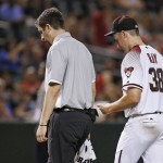 Arizona Diamondbacks' Robbie Ray (38) leaves the game due to injury has he walks off the field with Diamondbacks assistant athletic trainer Ryan DiPanfilo, left, during the seventh inning of a baseball game against the Philadelphia Phillies Monday, June 27, 2016, in Phoenix. The Phillies defeated the Diamondbacks 8-0. (AP Photo/Ross D. Franklin)