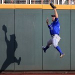 UC Santa Barbara center fielder Andrew Calica catches a fly ball by Arizona's Bobby Dalbec during the third inning of an NCAA College World Series baseball game, Wednesday, June 22, 2016, in Omaha, Neb.(AP Photo/Nati Harnik)