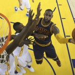 Cleveland Cavaliers forward LeBron James, right, shoots against the Golden State Warriors during the second half of Game 2 of basketball's NBA Finals in Oakland, Calif., Thursday, June 2, 2016. The Warriors won 104-89. (Ezra Shaw, Getty Images via AP, Pool)
