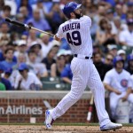 Chicago Cubs' Jake Arrieta watches his RBI double during the second inning of a baseball game against the Arizona Diamondbacks, Sunday, June 5, 2016, in Chicago. (AP Photo/Paul Beaty)