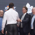 Toronto Maple Leafs pick Auston Matthews shakes hands with Maple Leafs coach Mike Babcock at the NHL hockey draft, Friday, June 24, 2016, in Buffalo, N.Y. (Nathan Denette/The Canadian Press via AP)