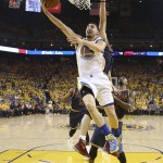 Golden State Warriors guard Klay Thompson (11) shoots against the Cleveland Cavaliers during the first half of Game 2 of basketball's NBA Finals in Oakland, Calif., Sunday, June 5, 2016. (Ezra Shaw, Getty Images via AP, Pool)