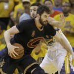 Cleveland Cavaliers forward Kevin Love (0) is defended by Golden State Warriors guard Klay Thompson (11) during the first half of Game 7 of basketball's NBA Finals in Oakland, Calif., Sunday, June 19, 2016. (AP Photo/Marcio Jose Sanchez)