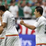 Mexico's Javier 'Chicharito' Hernandez, right, gives a thumbs up after a goal is scored by Hector Herrera (16) against Uruguay during the first half of a Copa America group C soccer match at University of Phoenix Stadium, Sunday, June 5, 2016, in Glendale, Ariz. (AP Photo/Ross D. Franklin)