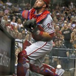 Philadelphia Phillies' Cameron Rupp is unable to make a catch on a foul ball hit by Arizona Diamondbacks' Welington Castillo during the fourth inning of a baseball game Monday, June 27, 2016, in Phoenix. (AP Photo/Ross D. Franklin)