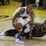 Golden State Warriors forward Andre Iguodala (9) dribbles in front of Cleveland Cavaliers center Tristan Thompson during the first half of Game 2 of basketball's NBA Finals in Oakland, Calif., Sunday, June 5, 2016. (AP Photo/Marcio Jose Sanchez)