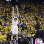 Golden State Warriors guard Klay Thompson (11) shoots against Cleveland Cavaliers forward Channing Frye (9) during the first half of Game 2 of basketball's NBA Finals in Oakland, Calif., Sunday, June 5, 2016. (AP Photo/Marcio Jose Sanchez)