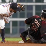 Houston Astros second baseman Jose Altuve, left, tags out Arizona Diamondbacks' Yasmany Tomas on a steal attempt to end the fifth inning of a baseball game, Wednesday, June 1, 2016, in Houston. (AP Photo/Eric Christian Smith)
