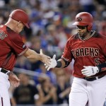 Arizona Diamondbacks' Rickie Weeks (5) shakes hands with third base coach Matt Williams (9) as Weeks rounds the bases after connecting for a home run against the Los Angeles Dodgers during the second inning of a baseball game Wednesday, June 15, 2016, in Phoenix. (AP Photo/Ross D. Franklin)