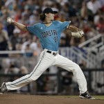 Coastal Carolina pitcher Bobby Holmes throws against Arizona in the seventh inning in Game 2 of the NCAA Men's College World Series finals baseball game in Omaha, Neb., Tuesday, June 28, 2016. (AP Photo/Nati Harnik)