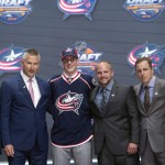 Pierre-Luc Dubois, third from left, third overall pick, stands with members of the Columbus Blue Jackets management team at the NHL draft in Buffalo, N.Y., Friday June 24, 2016. (Nathan Denette/The Canadian Press via AP) MANDATORY CREDIT