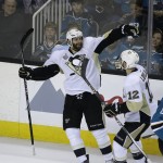 Pittsburgh Penguins right wing Eric Fehr, left, is greeted by teammate Ben Lovejoy, right, after scoring a goal against the San Jose Sharks during the third period of Game 4 of the NHL hockey Stanley Cup Finals in San Jose, Calif., Monday, June 6, 2016. Pittsburgh won the game 3-1. (AP Photo/Eric Risberg)