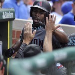 Arizona Diamondbacks' Michael Bourn celebrates with teammates in the dugout after scoring on a Paul Goldschmidt single during the fifth inning of a baseball game against the Chicago Cubs, Sunday, June 5, 2016, in Chicago. (AP Photo/Paul Beaty)