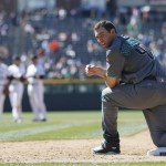 Arizona Diamondbacks' Paul Goldschmidt, front, kneels on first base after hitting a single to drive in two runs off Colorado Rockies starting pitcher Chad Bettis in the sixth inning of a baseball game Sunday, June 26, 2016, in Denver. (AP Photo/David Zalubowski)