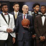 
              NBA Commissioner Adam Silver, center, poses for photos with prospective NBA draft picks Buddy Hield, left, Kris Dunn, right, Ben Simmons, third from left, and Brandon Ingram, second from right, before the NBA basketball draft, Thursday, June 23, 2016, in New York. (AP Photo/Frank Franklin II)
            