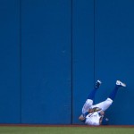 
              RETRANSMISSION TO CLARIFY THAT THE BATTER WAS OUT - Toronto Blue Jays center fielder Kevin Pillar (11) makes a diving catch against the wall on a line drive by Arizona Diamondbacks left fielder Peter O'Brien (14) during the fourth inning of a baseball game, Tuesday, June 21, 2016, in Toronto. (Nathan Denette/The Canadian Press via AP) MANDATORY CREDIT
            