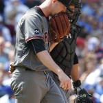 Arizona Diamondbacks starter Archie Bradley, left, talks with catcher Welington Castillo during the sixth inning of a baseball game against the Chicago Cubs Friday, June 3, 2016, in Chicago. (AP Photo/Nam Y. Huh)