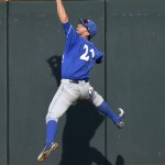 UC Santa Barbara center fielder Andrew Calica leaps catches a fly ball by Arizona's Bobby Dalbec during the third inning of an NCAA College World Series baseball game, Wednesday, June 22, 2016, in Omaha, Neb. (AP Photo/Ted Kirk)