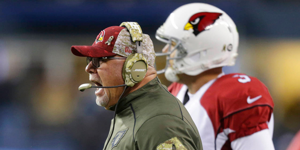 Arizona Cardinals coach Bruce Arians yells as he stands next to quarterback Carson Palmer during th...