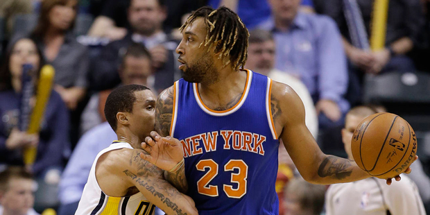 New York Knicks' Derrick Williams (23) is defended by Indiana Pacers' George Hill (3) during the se...