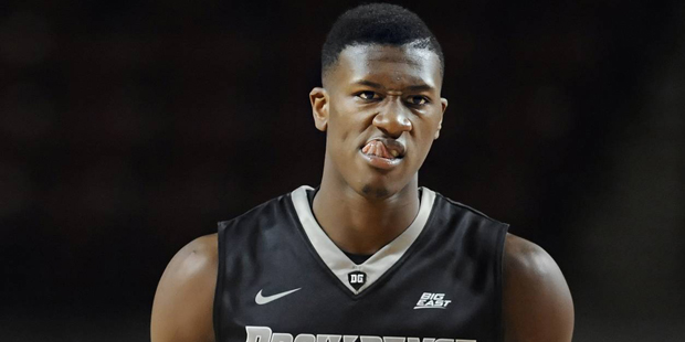 Providence's Kris Dunn reacts after hitting a three-point basket in the second half of an NCAA coll...