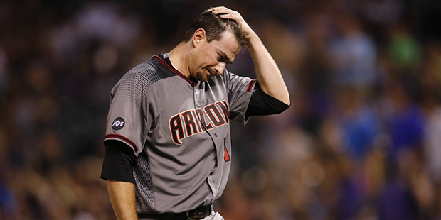 Arizona Diamondbacks relief pitcher Daniel Hudson reacts as he is pulled form the mound after givin...