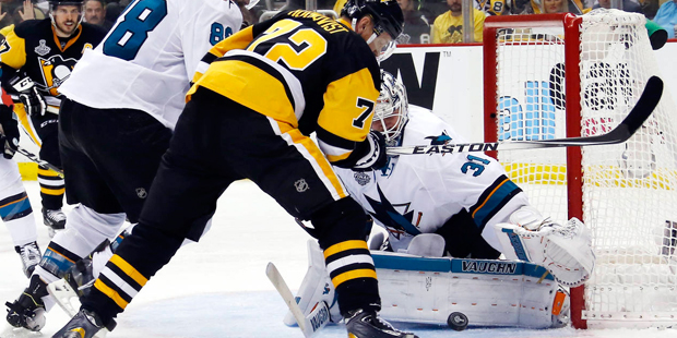 San Jose Sharks goalie Martin Jones (31) turns a shot away as Pittsburgh Penguins' Patric Hornqvist...