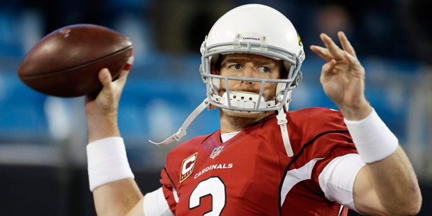 Arizona Cardinals' Carson Palmer warms up before the NFL football NFC Championship game against the...