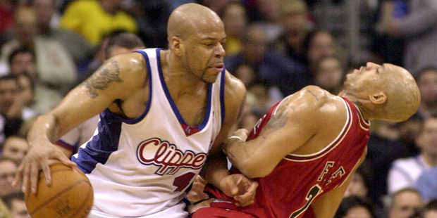 Chicago Bulls' Marcus Fizer, right, is knocked off balance by Los Angeles Clippers' Sean Rooks in t...