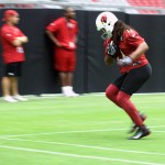 Receiver Larry Fitzgerald keeps his feet in bounds during training camp July 30. (Photo by Adam Green/Arizona Sports)