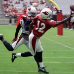 John Brown tries to come down with the ball in the end zone as Patrick Peterson defends during training camp on July 31. (Photo by Adam Green/Arizona Sports)