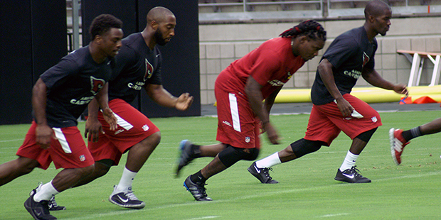 Kerwynn Williams, Stepfan Taylor, Chris Johnson and John Brown go through the conditioning test at ...