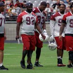 Defensive linemen Red Bryant, Frostee Rucker, Calais Campbell, Corey Peters and Robert Nkemdiche walk the field during training camp July 30. (Photo by Adam Green/Arizona Sports)
