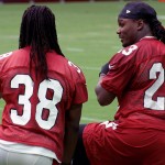 Running backs Chris Johnson and Andre Ellington chat during training camp July 30. (Photo by Adam Green/Arizona Sports)