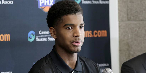 Phoenix Suns' first-round draft pick Marquese Chriss, left, speaks as head coach Earl Watson listen...